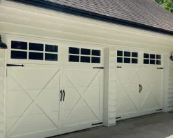 a garage door with a light on the roof