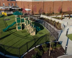 a backyard with a trampoline and a slide
