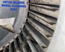 Close-up of dirty HK10A blower wheel with dust buildup and price $394 for cleaning service