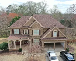 a house with a garage and a car parked in front