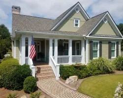 a house with a flag in the front yard