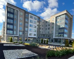 a building with a garden in front