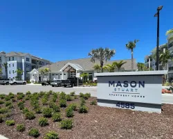 a sign in front of a building