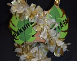 a pile of gold and green jewelry