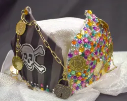 a colorful necklace on a white surface