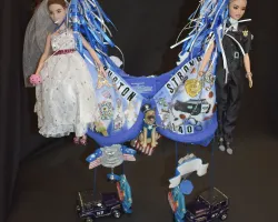 a poster of a couple of dolls