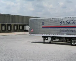 a large empty parking lot in front of a building