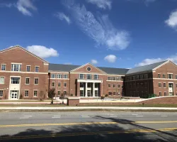 a building with a mountain in the background