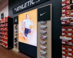 a shoe store with a poster