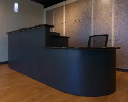 a blue rectangular table with a chair
