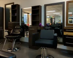 a room with chairs and shelves