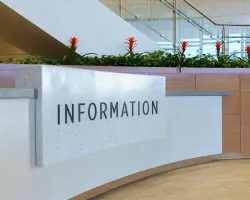 a white wall with a sign on it