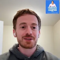 Two men in a split-screen video call talking about franchise coaching with visible microphones and branded elements.