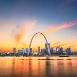 a city skyline with a rainbow