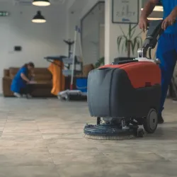 a person pushing a red cart