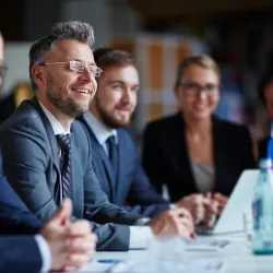 a group of people sitting at a table