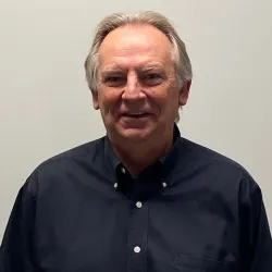 a man smiling for the camera