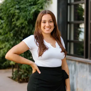 a woman smiling for the camera.