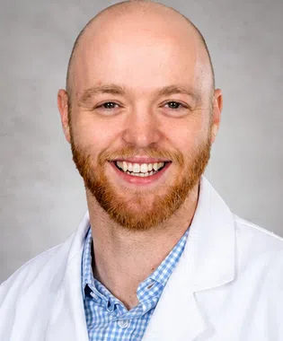 A portrait of Sullivan Smoak, MD.