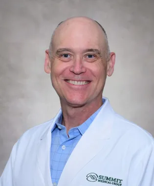 A portrait of Dennis Solomon, MD.