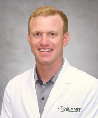 A portrait of Luke M. Hall, DO.