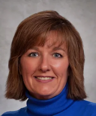 A portrait of Angela E. Meadows, MD.