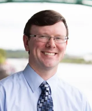 A portrait of Justin W. Quinn, MD.