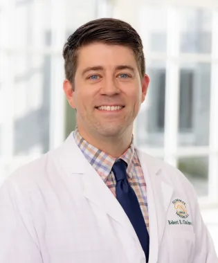 A portrait of Robert E. Chalmers, DO.