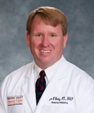a man wearing a suit and tie.