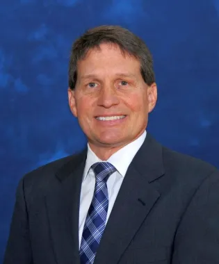 a man wearing a suit and tie.