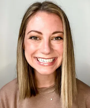 Woman smiling at the camera.