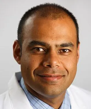 a man wearing a neck tie while posing for the camera.