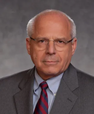 a man wearing a suit and tie.