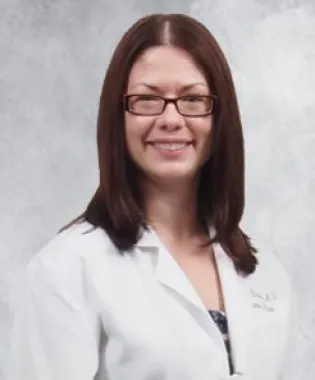 a person smiling for the camera.