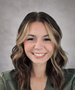 A portrait of Emily Yates, FNP-C.