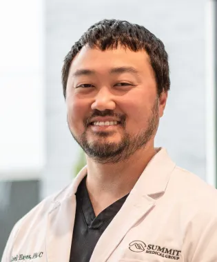 A portrait of Joel Hayes, PA-C.