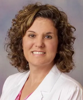 A portrait of Lora Cooper-Yoakum, FNP.