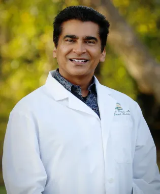 a man wearing a white coat.