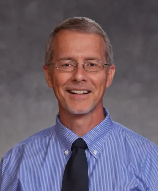 a man wearing a blue shirt.