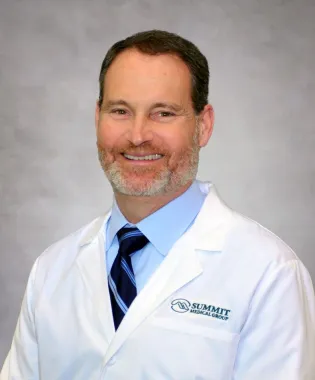 A portrait of Samuel R. Bastian, MD.