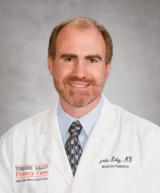 A portrait of John A. Kirby, MD.