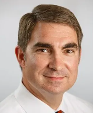 a man wearing a suit and tie.