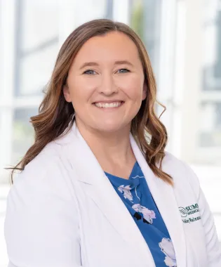 A portrait of Ashley Wainauski, PA-C.