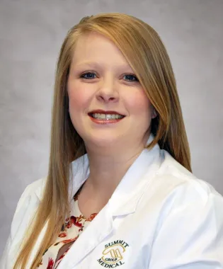 a woman smiling for the camera.