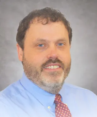 A portrait of Nathan A. Gray, MD.