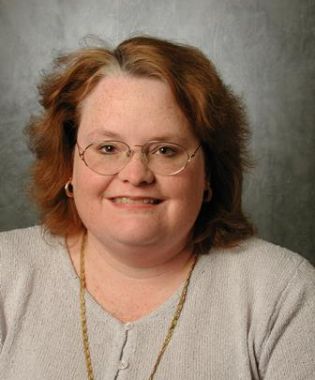 a woman wearing glasses.