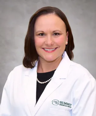 A portrait of Christie M. Carringer, MD.