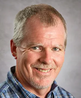 A portrait of Hollis Cotton, MD.