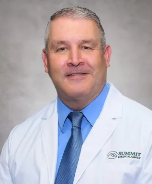 A portrait of Timothy D. Smith, MD.