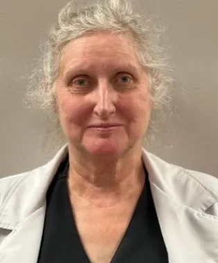 a woman with grey hair.